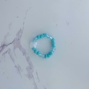 Super cute handmade teal color changing beaded ring.